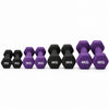 Purple dumbbells of various weights on a dark surface with a gray background