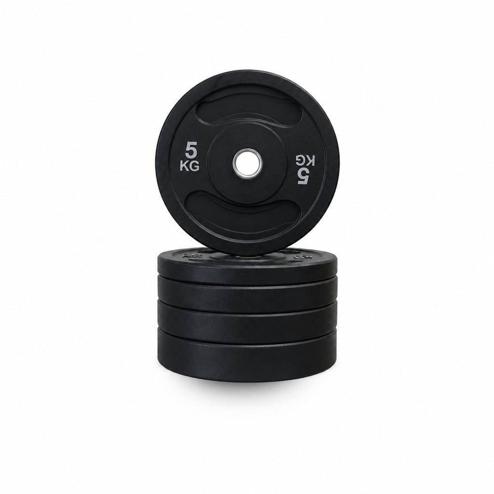 Black rubber weight plates stacked on a white background, with one plate on top showing '5 KG' printed in white.