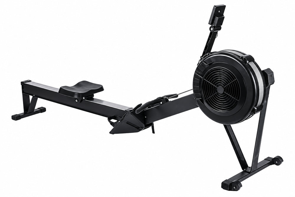 A black indoor rowing machine with a long rail, padded seat, footrest, and large circular flywheel on a stand, shown against a plain white background.