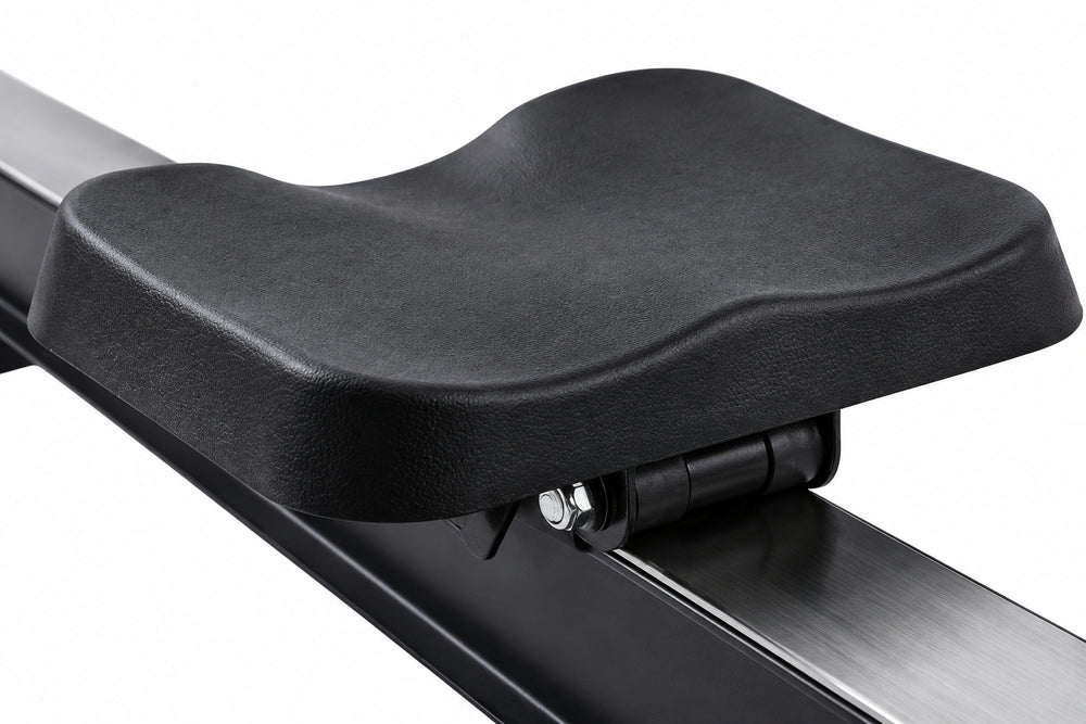 Close-up of a black padded exercise seat mounted on a dark metal frame, shown against a plain white background.