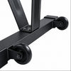 Close-up of a black metal table frame with two caster wheels on a white background.