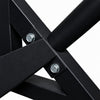 Close-up of a black metal frame with screws on a white background