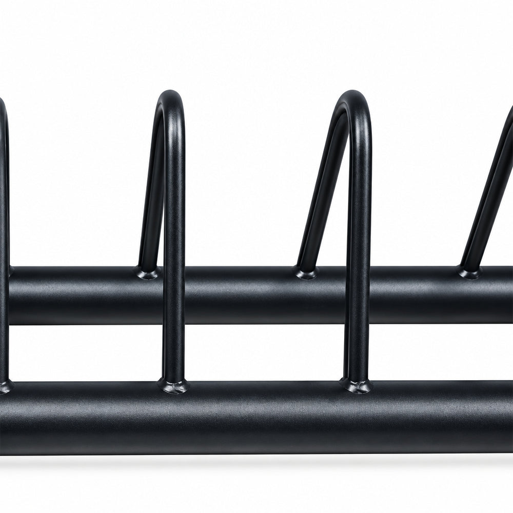 Close-up of a black metal rack with two horizontal bars and vertical loop supports, shown against a plain white background.