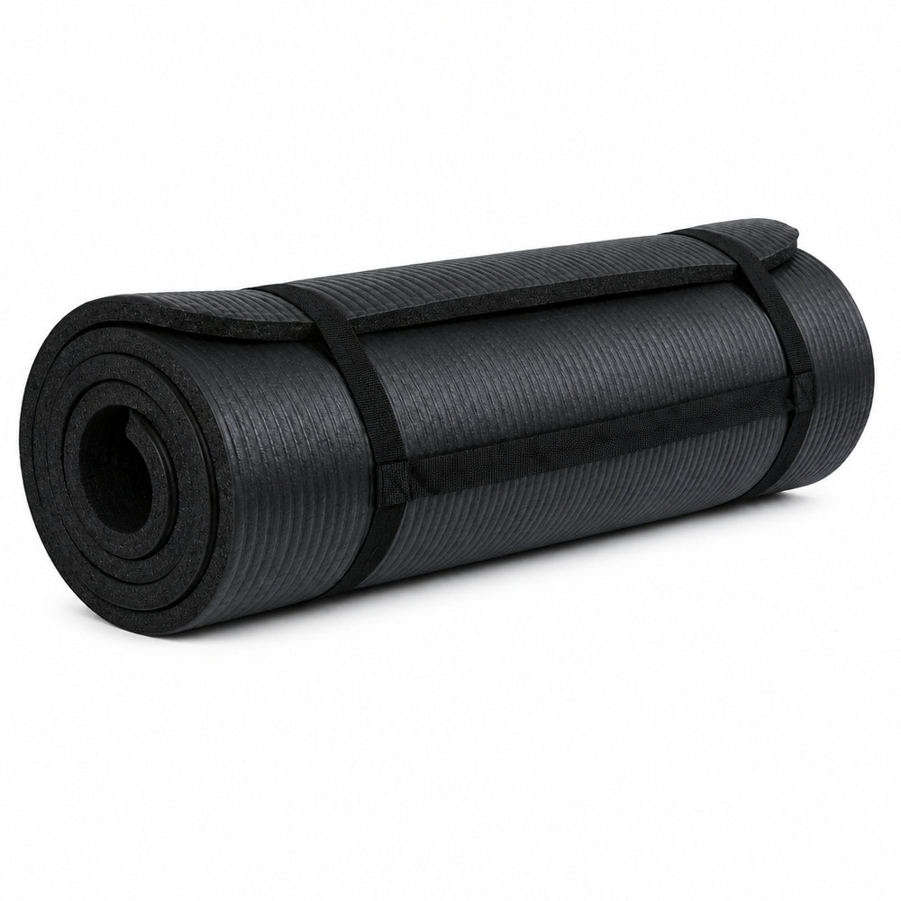A rolled black yoga mat with a black strap shown on a white background