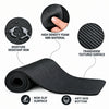 A black yoga mat shown rolled and partially unrolled on a white background, with three circular callout insets highlighting texture and features
