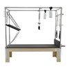 Front view of the GS Essential Cadillac Reformer in dark grey with tower frame and hanging springs