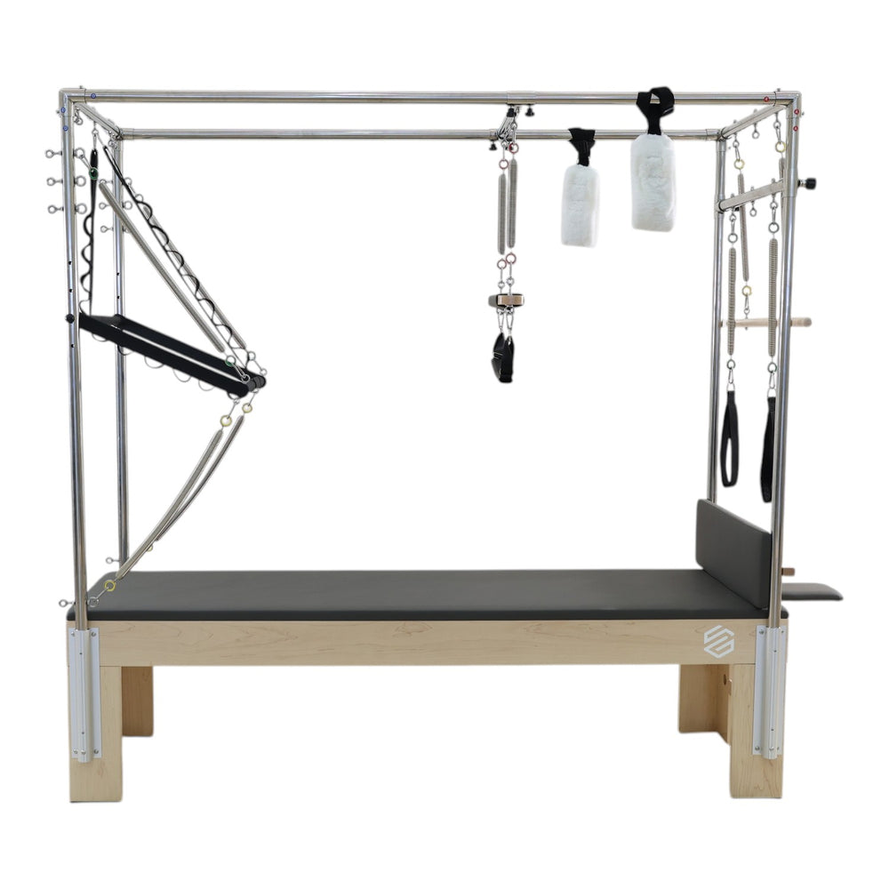 Front view of the GS Essential Cadillac Reformer in dark grey with tower frame and hanging springs