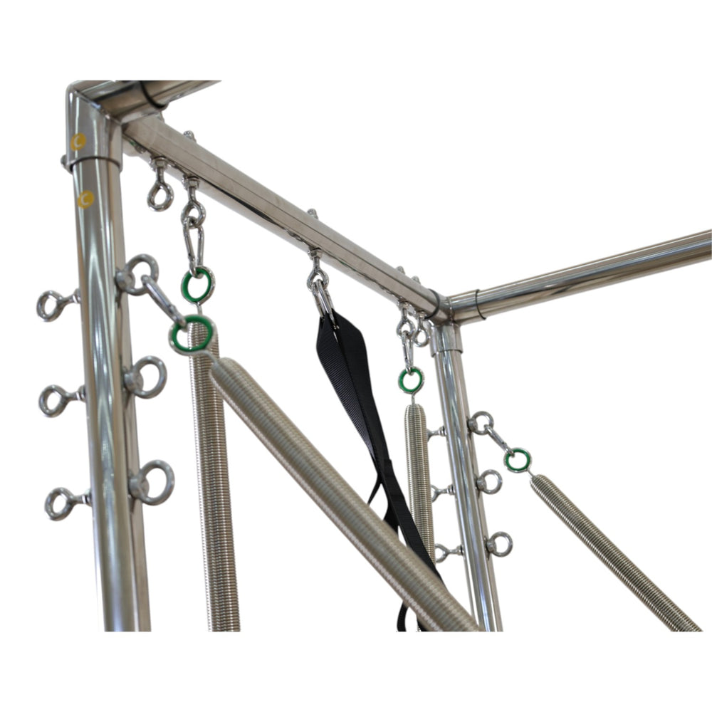 Close-up of the stainless steel corner joint and spring hooks on the Cadillac reformer frame
