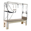 GS Essential Cadillac Reformer in light brown – full Pilates trapeze table with springs, straps and roll-down bar