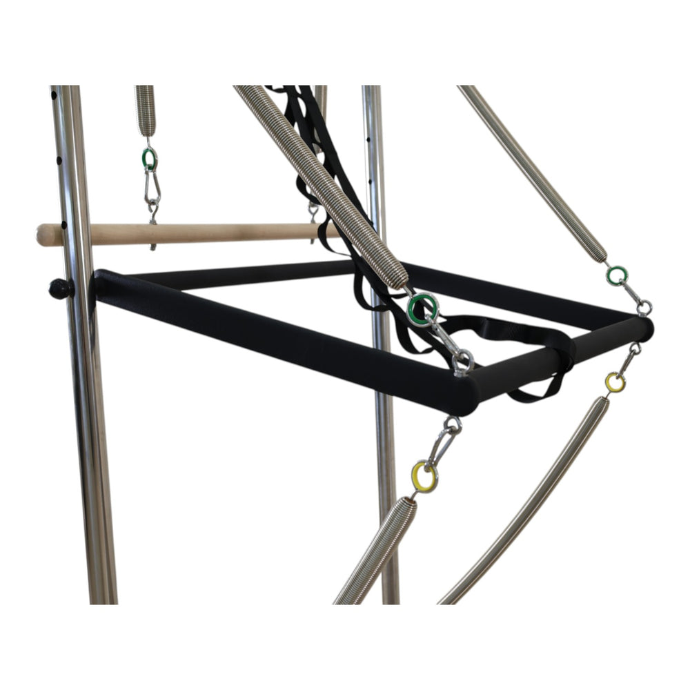 Close-up of the padded roll-down bar and spring attachments on the Cadillac reformer trapeze frame