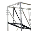 Close-up of the tower frame with springs, straps and trapeze bar on the Cadillac reformer