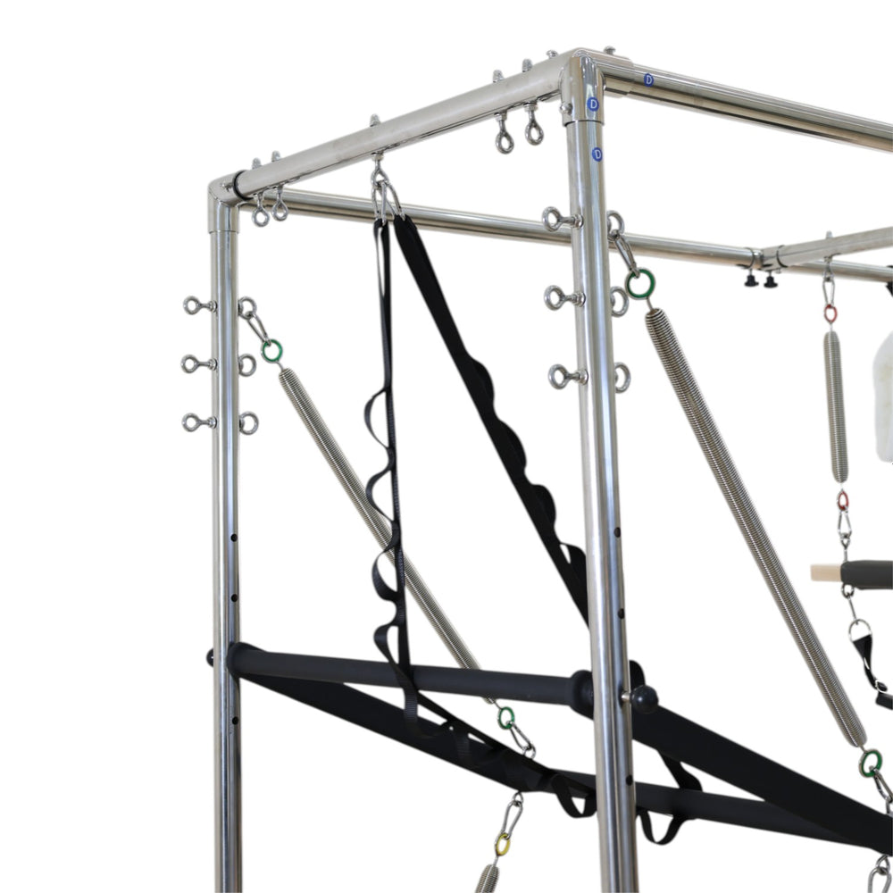 Close-up of the tower frame with springs, straps and trapeze bar on the Cadillac reformer