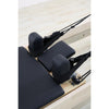 Gym Superstore professional wooden Pilates reformer carriage with black padded headrest, shoulder rests, and straps.