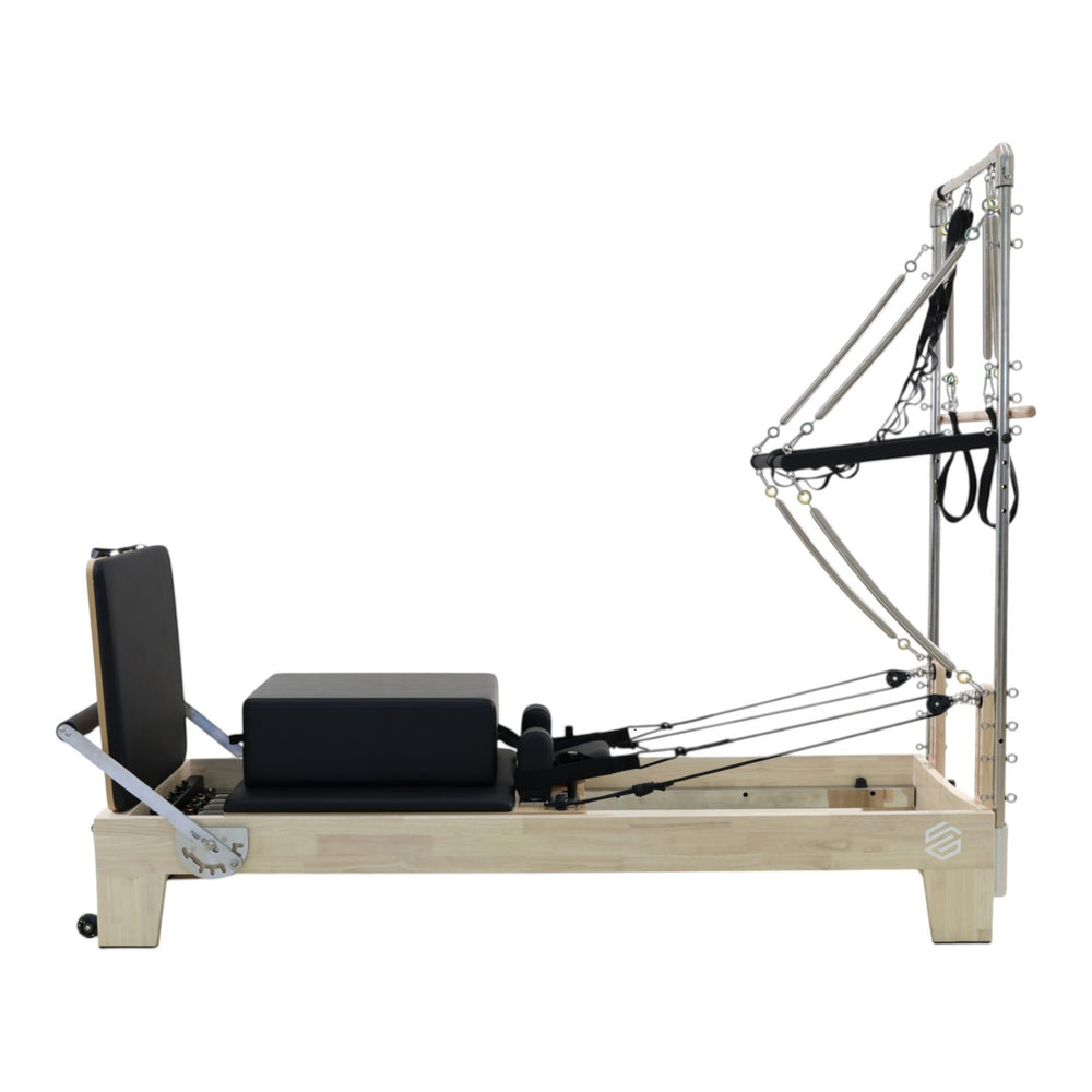 Gym Superstore professional wooden Pilates reformer with integrated tower attachment and black padded carriage