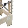 Gym Superstore professional wooden Pilates reformer featuring an integrated tower attachment with adjustable springs.