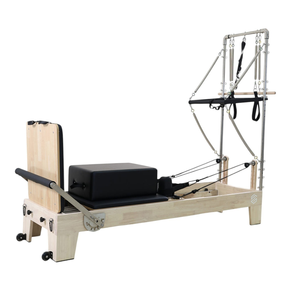 Gym Superstore professional wooden Pilates reformer with integrated tower attachment, black upholstery, and springs.