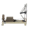Gym Superstore professional wooden Pilates reformer with integrated tower attachment and taupe padded carriage