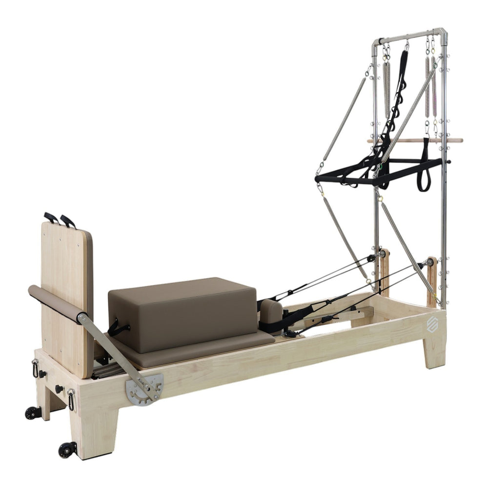 Gym Superstore professional wooden Pilates reformer with integrated tower attachment and grey padded carriage.
