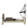 Gym Superstore professional wooden Pilates reformer with integrated tower attachment and taupe padded carriage