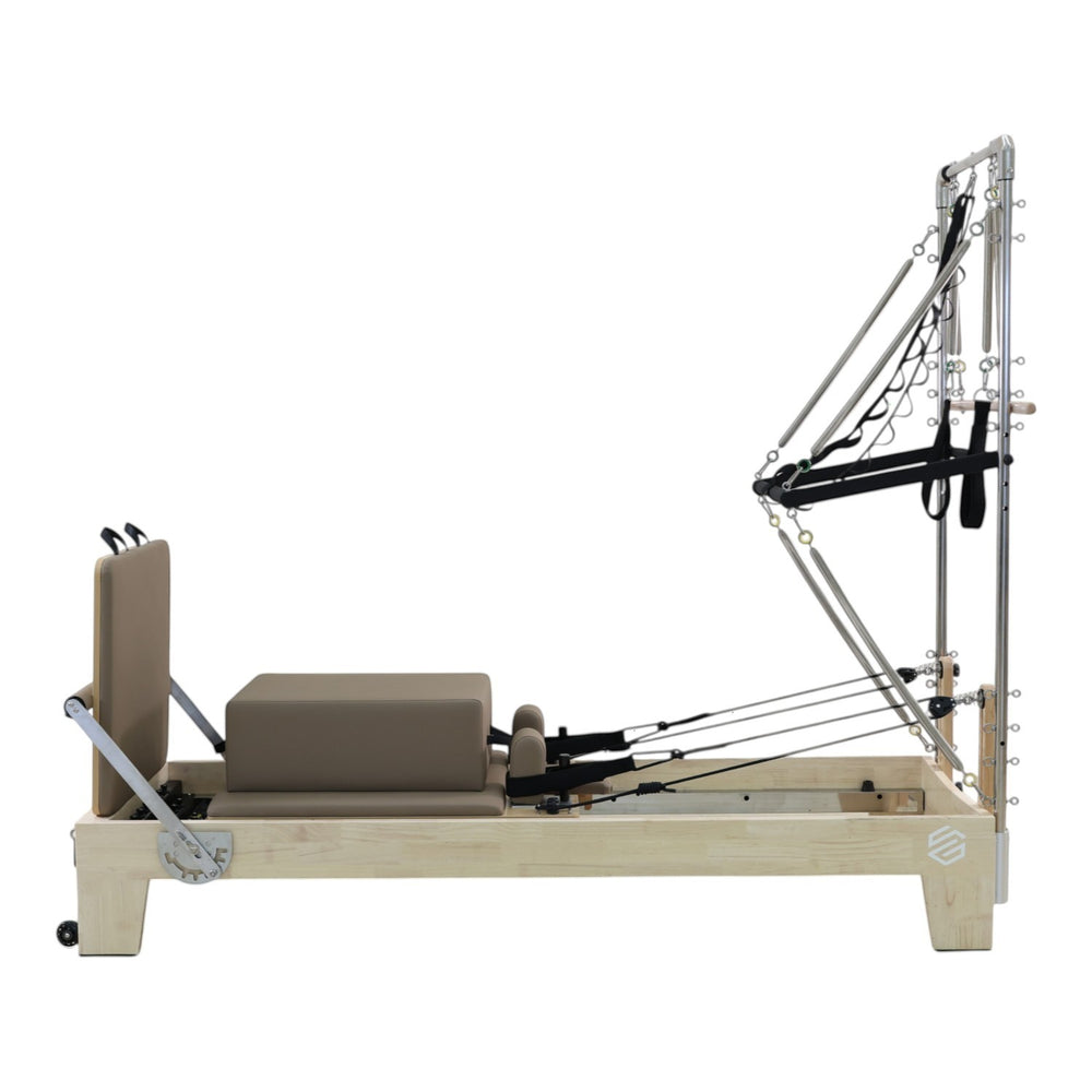 Gym Superstore professional wooden Pilates reformer with integrated tower attachment and taupe padded carriage