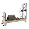 Gym Superstore professional wooden Pilates reformer with tower attachment, featuring taupe padding and metal springs.